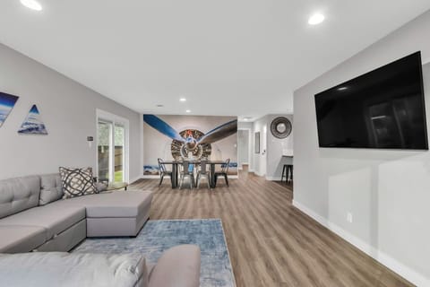 Kick back and relax in this updated and modern open concept living and dining areas