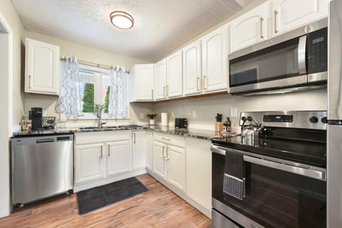 Clean kitchen with full appliances for all your cooking needs.