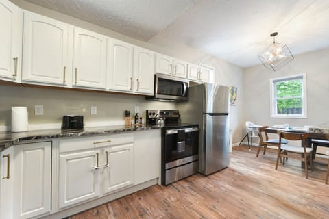 Clean kitchen with full appliances for all your cooking needs.
