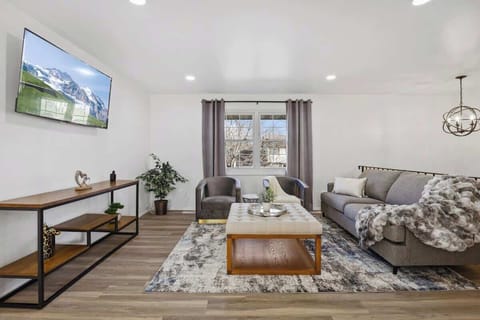 Embrace your family on the couch, laughter filling the room, creating a warm and cozy haven.