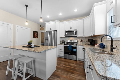 Full Kitchen with Major Appliances & Bar Seating