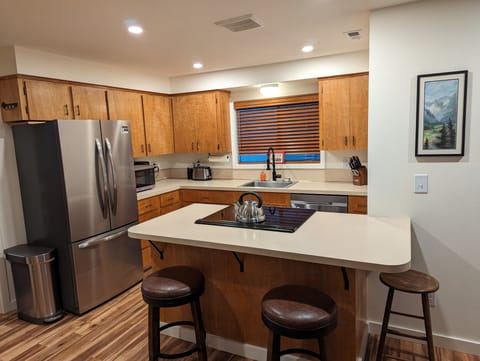 Fully stocked kitchen with new appliances.