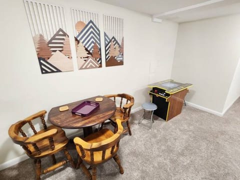 lower living room table/chairs and vintage Pac Man arcade game 