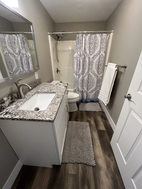 Combined shower/tub, hair dryer, towels, soap