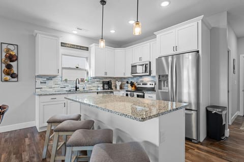 Full Kitchen with Major Appliances & Bar Seating