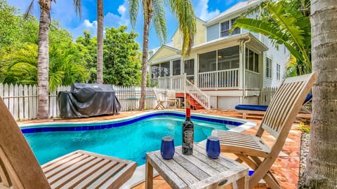 Enjoy this beautiful KW house with private heated pool with waterfall!