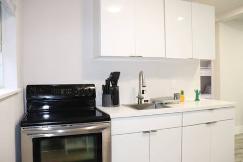 Kitchen featuring a sleek counter and stainless steel appliances.