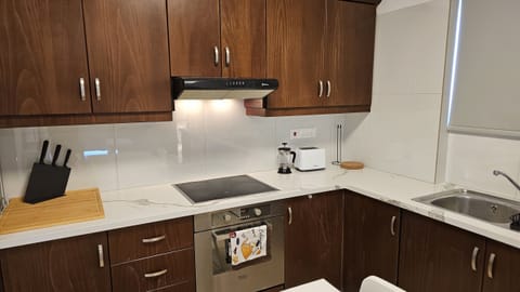 Fridge, oven, toaster, cookware/dishes/utensils