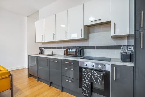 Cook up your favorite meals in this sleek, fully-equipped kitchen 🍳✨