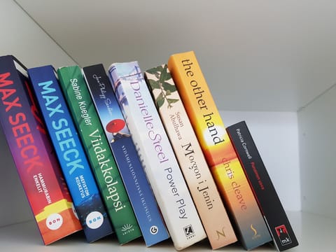 There is a small bookshelf. Bring your old book and take a new story to read.