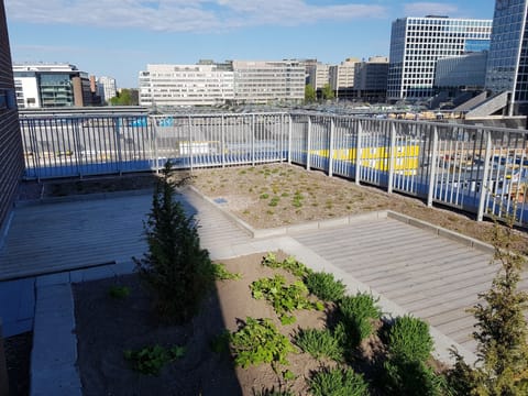 The balcony has view over the train tracks and the mall of Tripla.