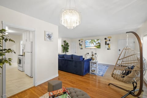 Open Floor Concept with Hanging Center Lights and Natural Lighting