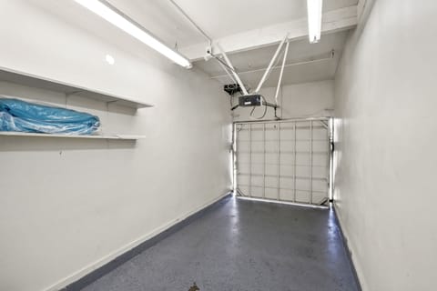 Private Parking Garage Space with Beach Wagon and Beach Chairs