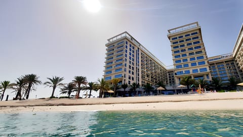 On the beach, sun loungers, beach towels