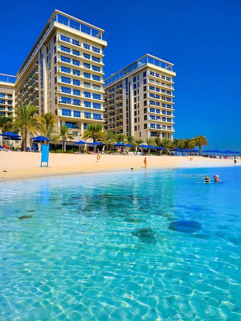 On the beach, sun loungers, beach towels