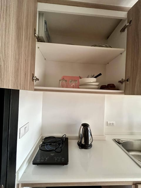 Fridge, microwave, stovetop, cookware/dishes/utensils