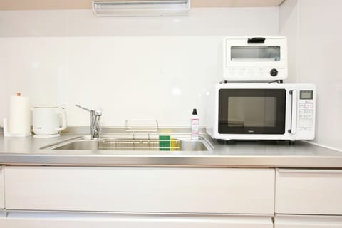 Fridge, microwave, cookware/dishes/utensils