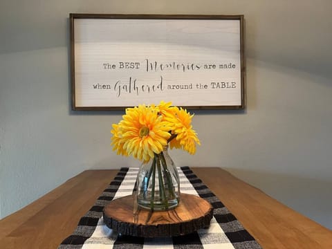 Our table with a flower vase is perfectly poised in front of the mirror, doubling the charm and adding a touch of floral flair to your space. It's like having your own personal garden indoors!