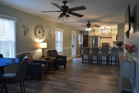 Enter the home through the carport, into an open-concept living room and kitchen