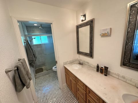 Shower, jetted tub, towels, soap