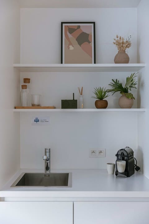 Compact kitchenette with essential amenities and modern simplicity 💙☕️