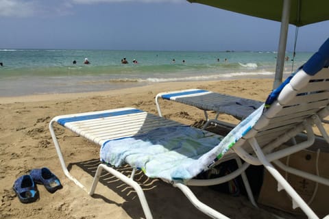 On the beach, sun loungers, beach towels