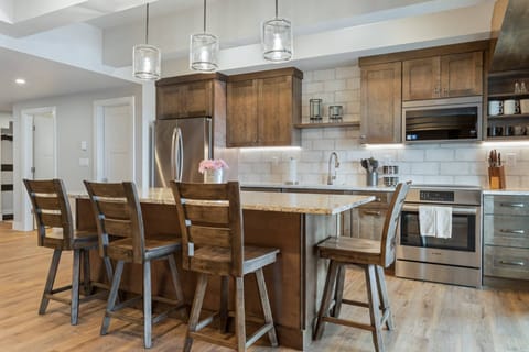 Indulge in the pleasure of preparing meals while engaging with loved ones, as the island becomes a natural gathering spot.