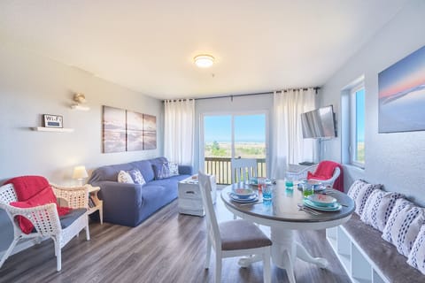 Living room provides lots of light and views of the beach.