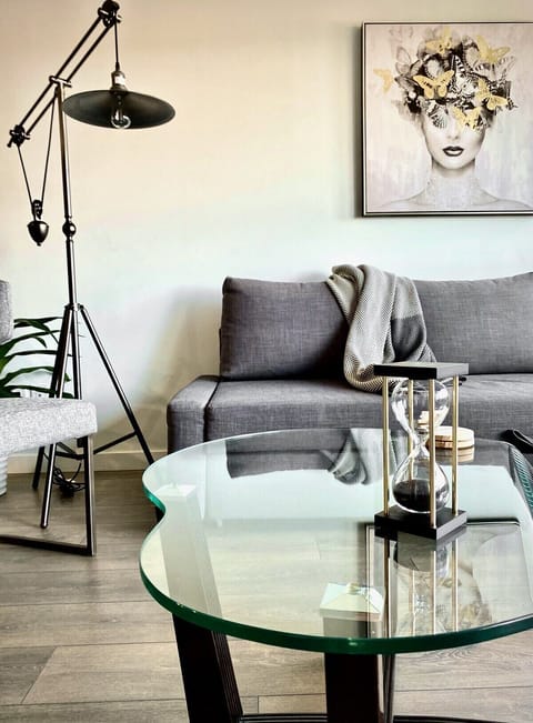 The Pendulum light & glass coffee table add to the fun decor & vibe  