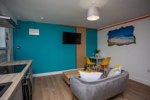 Step into serenity as you enter the sunlit sitting room of your tranquil abode. A plush, inviting couch takes center stage, promising hours of relaxation and comfort.