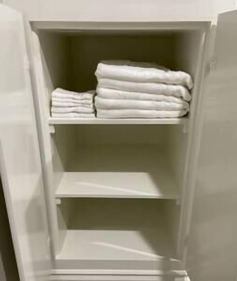 Upstairs Cabinet with towels for your stay.