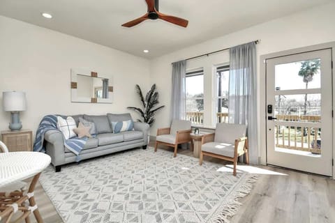 The large windows and glass door in the family room offers abundant natural lighting & brightness from sunny San Leon.