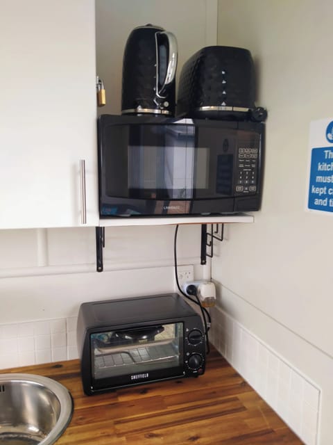 Kettle, toaster, microwave, 10L mini oven. You may BYO BBQ onto the lawn.