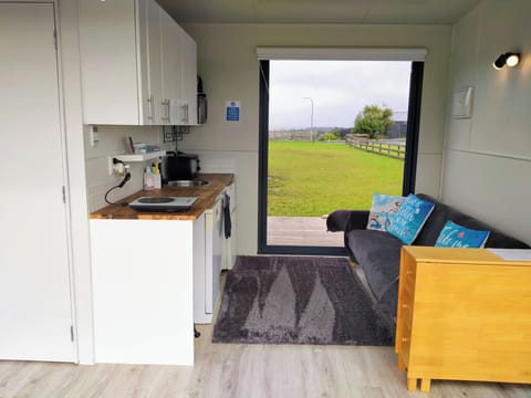 Kitchenette + Lounge with French doors for indoor-outdoor flow & beachview.