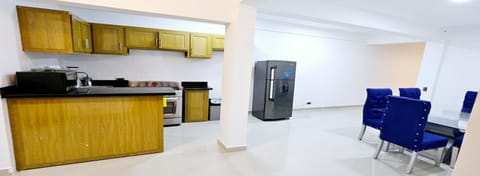 Fridge, oven, stovetop, dining tables