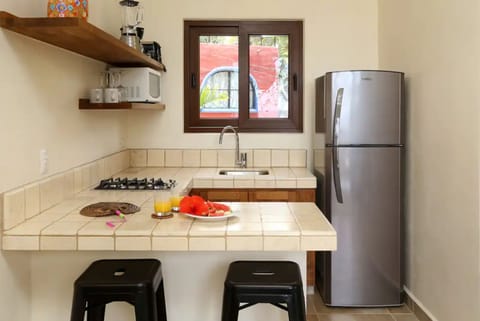 Fridge, microwave, stovetop, coffee/tea maker