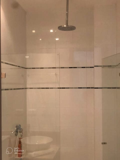 Combined shower/tub, hair dryer, towels, soap