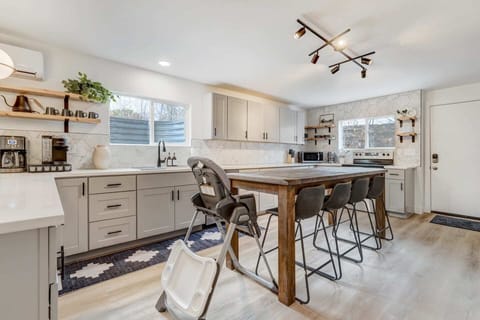 Gather around our dining table, perfect for enjoying meals and conversations. The inviting setting ensures every meal is a delightful experience, creating moments to savor.