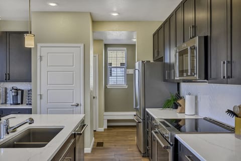 Modern appliances and large sink for the kitchen