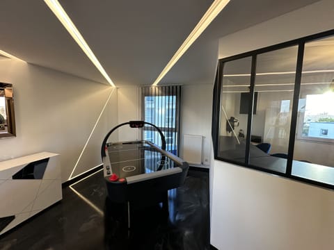 Designer Living Room with Giant Screen, All Global TV Channels, and an Air Game Arcade Game