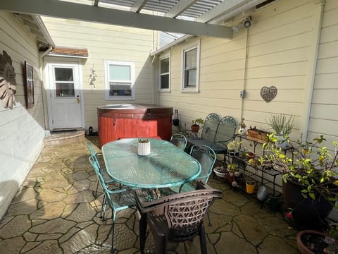 Patio also has hot tub for guests to use.