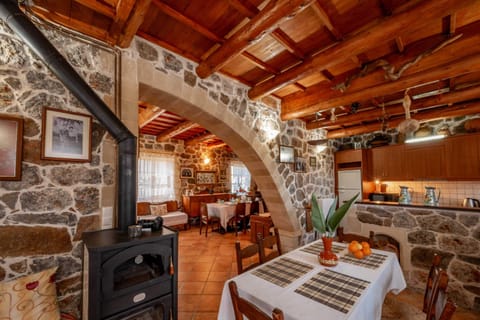 Cozy Dining Area with Wooden Beams – Warm space for shared meals.
