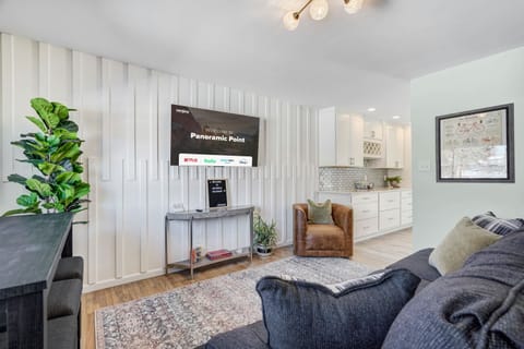 Our living room features a large and flat-screen TV,  soft lighting, plush seating and unique and interesting decor pieces, adding character and charm to the space.