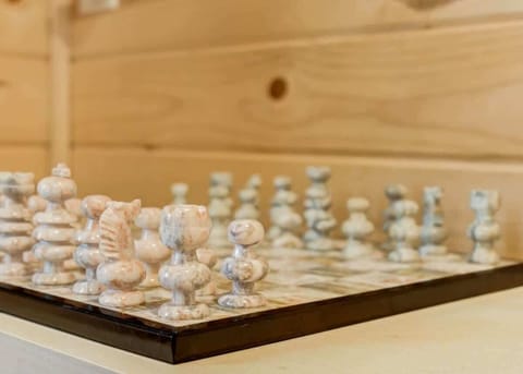 Challenge your mind with a game of chess in our inviting space. Sink into comfort, strategize your moves, and let the games begin in the cozy ambiance of your retreat.
