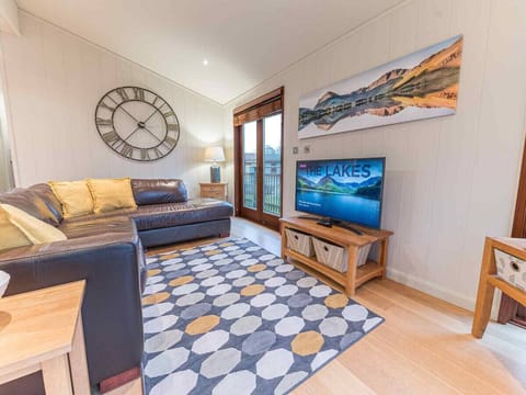 Open plan lounge/diner/kitchen with Smart TV and wood burner