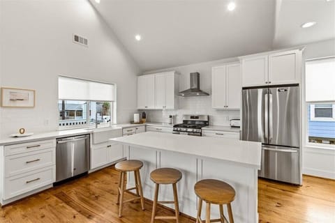 Gather around the sleek island and whip up coastal delights in style!