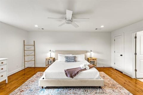 Tranquil vibes with modern decor, plush bedding, and lovely wood accents.