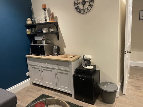The Kitchenette in the lounge has a microwave, coffee machine, kettle and fridge.,