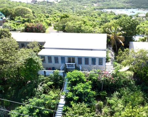 Resting high above Honeymoon beach, this house is part of a four unit compound 