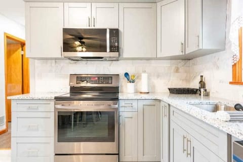 Kitchen with stainless steel appliances view 1